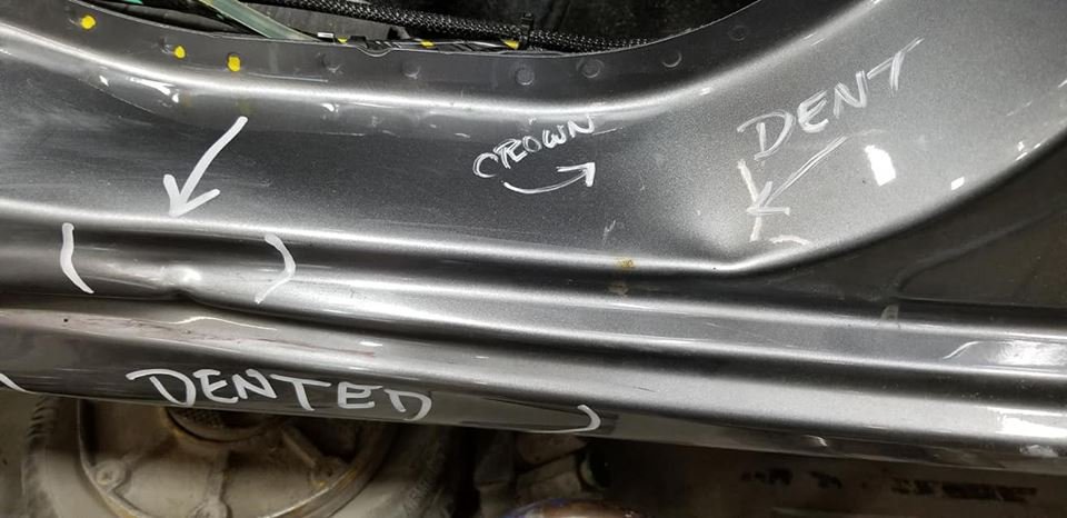 Technician marking a dent for repair at Cloot's Auto Body — Westfield, MA